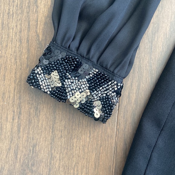 Long Sleeved Black Romper with Embellished Cuffs - Picture 3 of 6